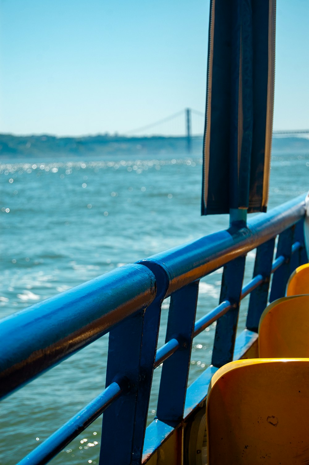 The Tagus from the open deck of a Lisbon ferry, with the 25 de Abril bridge behind